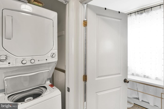 1240 Leopard St, Philadelphia, PA 19125 - washroom with baseboard heating, stacked washer / drying machine, and laundry area