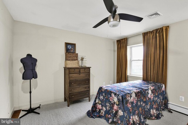 1240 Leopard St, Philadelphia, PA 19125 - carpeted bedroom with visible vents, baseboards, baseboard heating, and ceiling fan