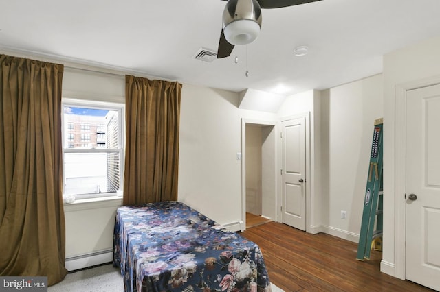 1240 Leopard St, Philadelphia, PA 19125 - bedroom featuring a ceiling fan, visible vents, wood finished floors, a baseboard heating unit, and baseboards