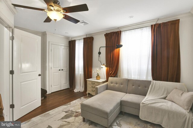 1240 Leopard St, Philadelphia, PA 19125 - living room with ornamental molding, visible vents, a ceiling fan, and wood finished floors