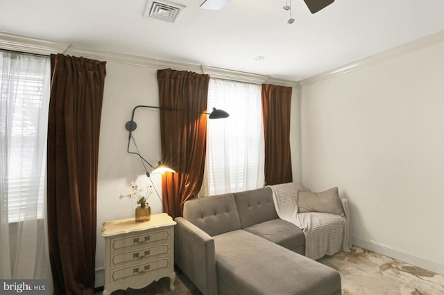 1240 Leopard St, Philadelphia, PA 19125 - living area featuring visible vents, baseboards, ceiling fan, crown molding, and carpet floors