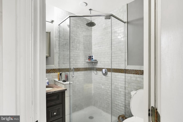 1240 Leopard St, Philadelphia, PA 19125 - full bath featuring tile walls, toilet, a stall shower, and vanity