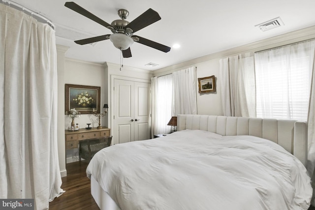 1240 Leopard St, Philadelphia, PA 19125 - bedroom with crown molding, a closet, dark wood-style floors, and visible vents
