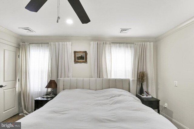 1240 Leopard St, Philadelphia, PA 19125 - bedroom with crown molding, visible vents, ceiling fan, and dark wood-style flooring