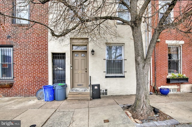 1240 Leopard St, Philadelphia, PA 19125 - view of exterior entry featuring stucco siding