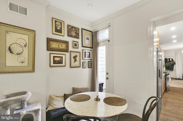 1240 Leopard St, Philadelphia, PA 19125 - dining room with recessed lighting, visible vents, crown molding, and wood finished floors