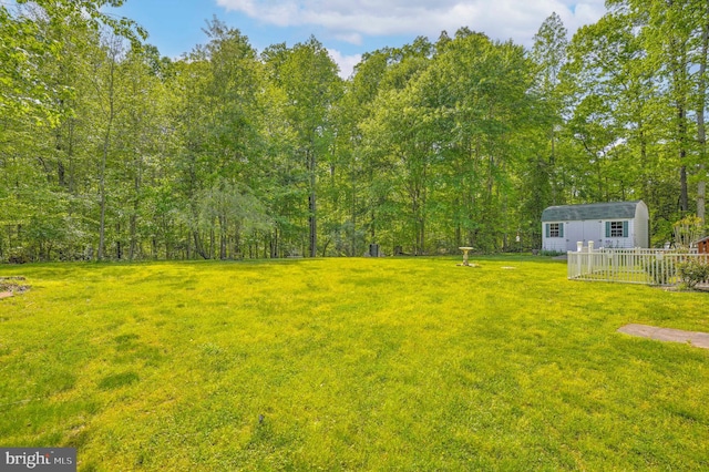 37217 Asher Rd, Mechanicsville, MD 20659 - view of yard featuring an outdoor structure and a forest view