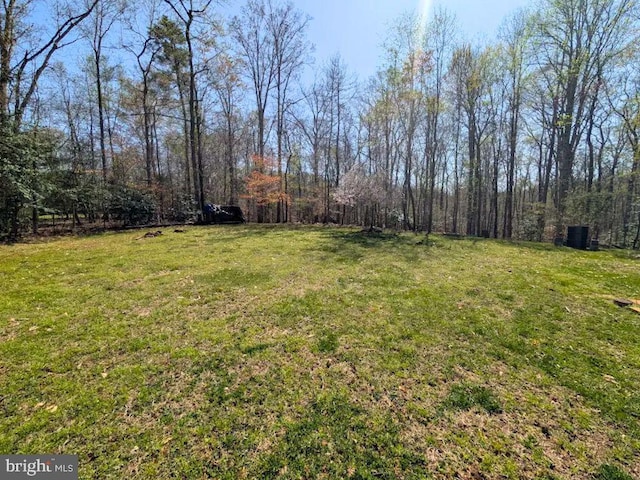 37217 Asher Rd, Mechanicsville, MD 20659 - view of yard featuring a view of trees and central AC unit