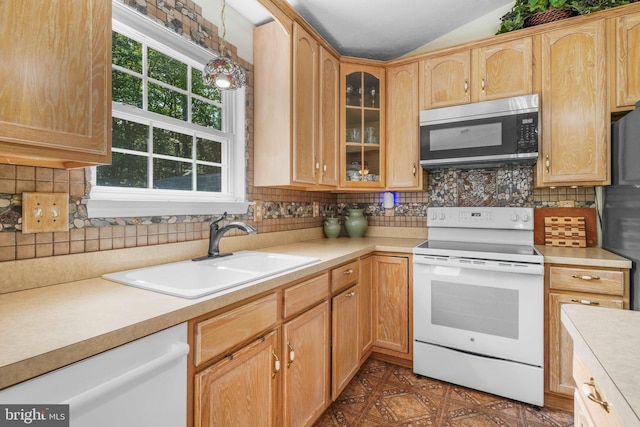 37217 Asher Rd, Mechanicsville, MD 20659 - kitchen featuring lofted ceiling, white appliances, glass insert cabinets, light countertops, and a sink