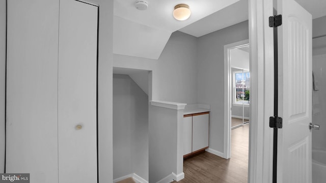 1315 Riverwood, Baltimore, MD 21226 - corridor featuring baseboards, vaulted ceiling, and wood finished floors