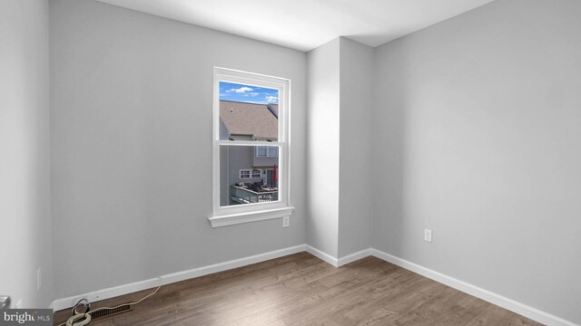 1315 Riverwood, Baltimore, MD 21226 - unfurnished room featuring baseboards and wood finished floors