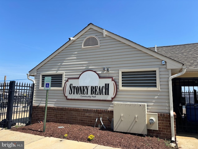 1315 Riverwood, Baltimore, MD 21226 - exterior space with brick siding, a shingled roof, and fence