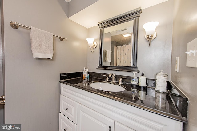 bathroom featuring visible vents and vanity