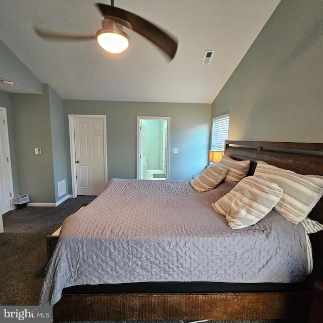 carpeted bedroom featuring baseboards, vaulted ceiling, connected bathroom, visible vents, and ceiling fan