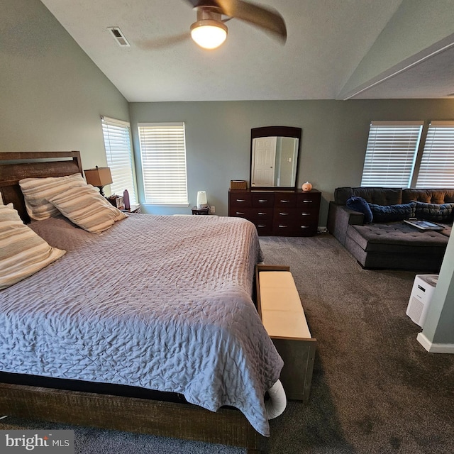 carpeted bedroom featuring visible vents, ceiling fan, and lofted ceiling