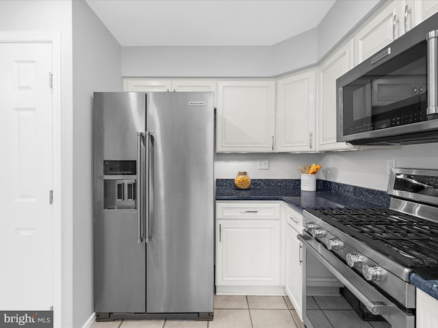 142 Tall Tree Trl, Arnold, MD 21012 - kitchen featuring white cabinets, stainless steel appliances, and light tile patterned floors