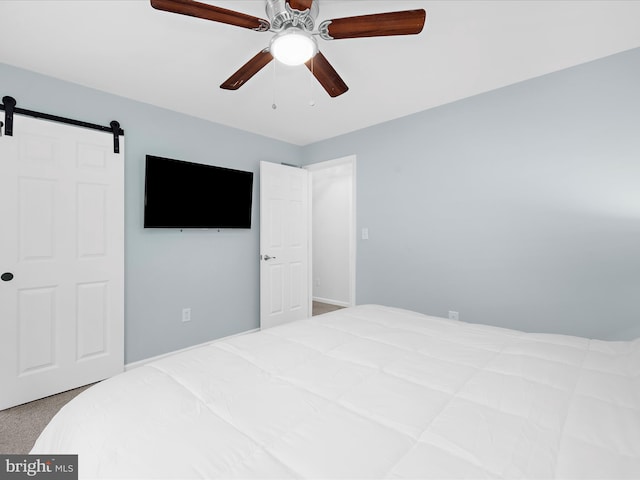 142 Tall Tree Trl, Arnold, MD 21012 - bedroom featuring a barn door, carpet flooring, and ceiling fan