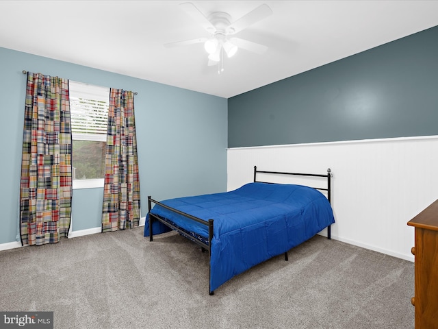142 Tall Tree Trl, Arnold, MD 21012 - carpeted bedroom with a wainscoted wall, baseboards, and ceiling fan