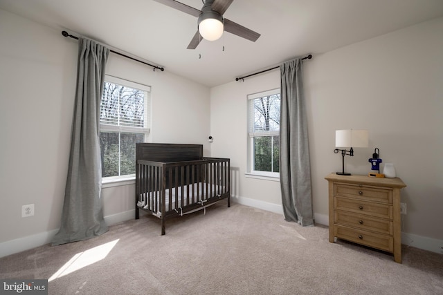12455 Sea Oaks Ln Unit 4, Berlin, MD 21811 - bedroom featuring light carpet, baseboards, a ceiling fan, and a nursery area