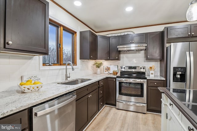 28 Beech Hill Dr, Newark, DE 19711 - kitchen featuring a sink, light wood-style floors, dark brown cabinetry, appliances with stainless steel finishes, and under cabinet range hood