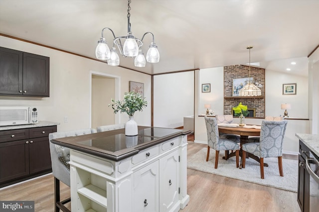 28 Beech Hill Dr, Newark, DE 19711 - kitchen featuring light wood finished floors, white microwave, white cabinetry, a brick fireplace, and open shelves