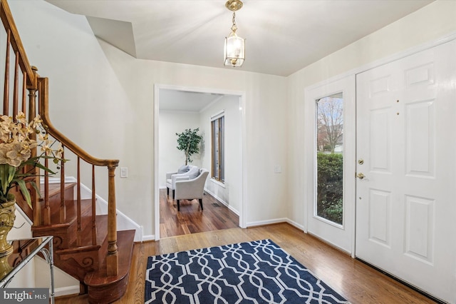 28 Beech Hill Dr, Newark, DE 19711 - entryway featuring baseboards, wood finished floors, and stairway