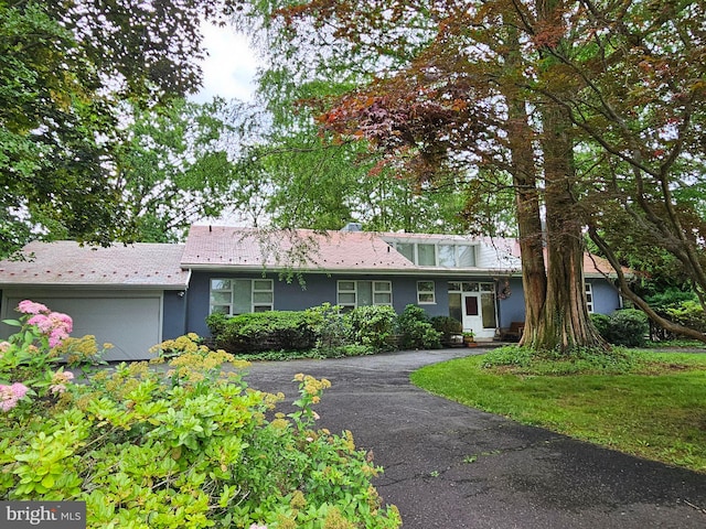 1426 Bryant Ln, Meadowbrook, PA 19046 - view of front of house with stucco siding and asphalt driveway