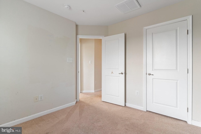 5542 Peanuts Ln, Waldorf, MD 20602 - unfurnished bedroom with baseboards, visible vents, and light carpet