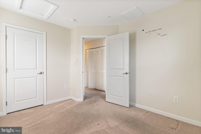 5542 Peanuts Ln, Waldorf, MD 20602 - unfurnished bedroom featuring baseboards, visible vents, attic access, and light colored carpet
