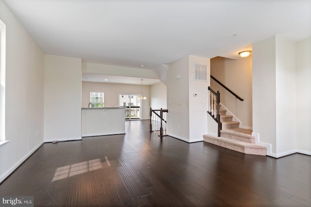 5542 Peanuts Ln, Waldorf, MD 20602 - unfurnished living room with dark wood-style flooring, baseboards, and visible vents