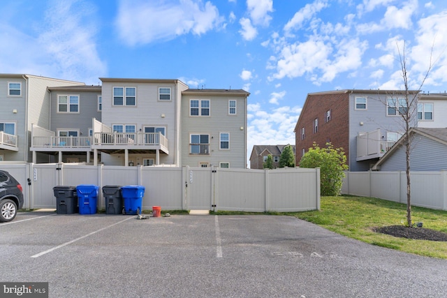 5542 Peanuts Ln, Waldorf, MD 20602 - uncovered parking lot with fence, a gate, and a residential view