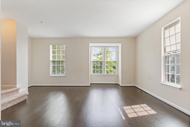 5542 Peanuts Ln, Waldorf, MD 20602 - unfurnished room featuring dark wood-type flooring, baseboards, and stairs