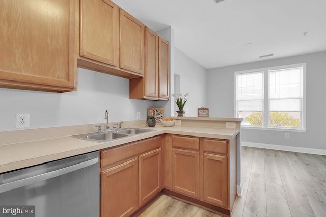 503 King Farm Blvd Unit 306, Rockville, MD 20850 - kitchen featuring stainless steel dishwasher, a sink, light wood-type flooring, light countertops, and a peninsula