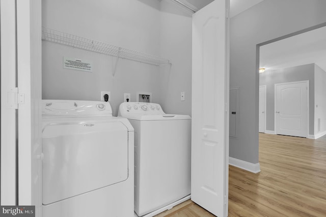 503 King Farm Blvd Unit 306, Rockville, MD 20850 - clothes washing area with washing machine and dryer, wood finished floors, and baseboards