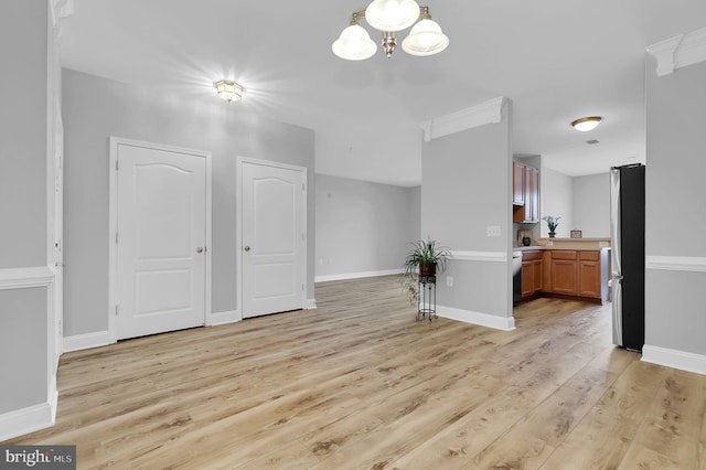 503 King Farm Blvd Unit 306, Rockville, MD 20850 - dining room with light wood finished floors, a chandelier, and baseboards