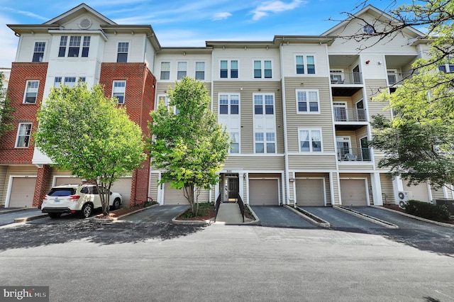 503 King Farm Blvd Unit 306, Rockville, MD 20850 - view of property with driveway and an attached garage