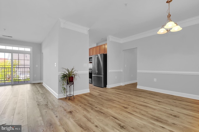 503 King Farm Blvd Unit 306, Rockville, MD 20850 - kitchen with stainless steel appliances, open floor plan, light wood-type flooring, crown molding, and hanging light fixtures