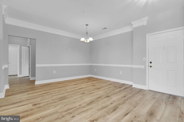 503 King Farm Blvd Unit 306, Rockville, MD 20850 - spare room with a chandelier, crown molding, wood finished floors, and baseboards