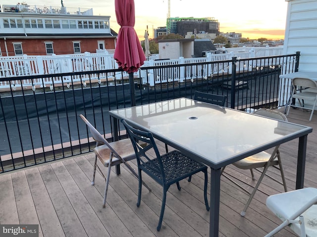 wooden deck with outdoor dining area