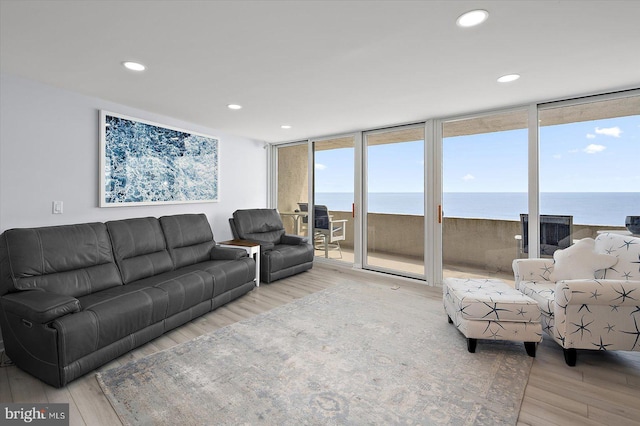 8500 Coastal Hwy Unit 805, Ocean City, MD 21842 - living room featuring a water view, recessed lighting, wood finished floors, and expansive windows