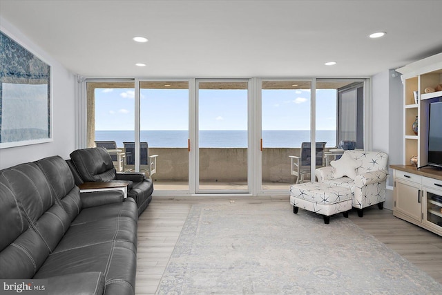8500 Coastal Hwy Unit 805, Ocean City, MD 21842 - living area with a healthy amount of sunlight, recessed lighting, light wood-type flooring, and a wall of windows