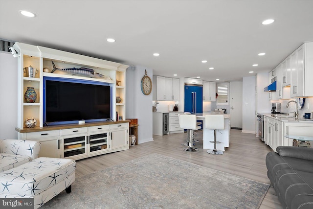 8500 Coastal Hwy Unit 805, Ocean City, MD 21842 - living room with visible vents, light wood-style flooring, recessed lighting, and beverage cooler