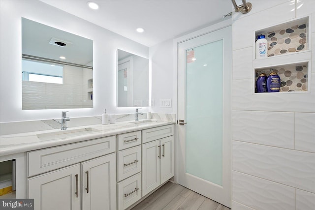 8500 Coastal Hwy Unit 805, Ocean City, MD 21842 - full bath featuring a sink, recessed lighting, double vanity, and wood finished floors
