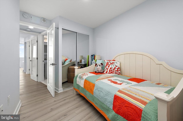 8500 Coastal Hwy Unit 805, Ocean City, MD 21842 - bedroom featuring a closet, light wood-style flooring, and baseboards