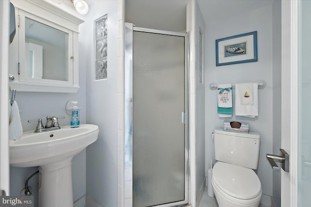 8500 Coastal Hwy Unit 805, Ocean City, MD 21842 - bathroom featuring a sink, toilet, and a shower stall