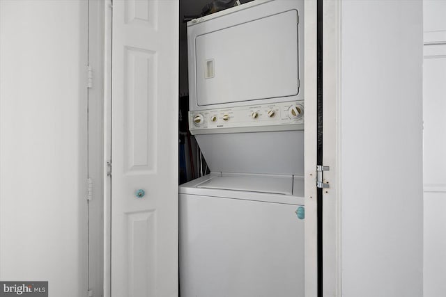 8500 Coastal Hwy Unit 805, Ocean City, MD 21842 - laundry area featuring stacked washing maching and dryer and laundry area