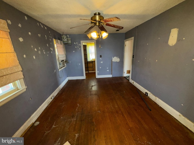 605 Walnut Ave, Baltimore, MD 21229 - interior space with a textured ceiling, baseboards, a ceiling fan, cooling unit, and wood-type flooring