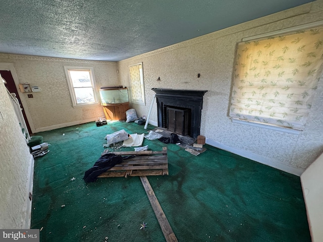 605 Walnut Ave, Baltimore, MD 21229 - unfurnished living room with a fireplace, carpet flooring, a textured ceiling, and wallpapered walls