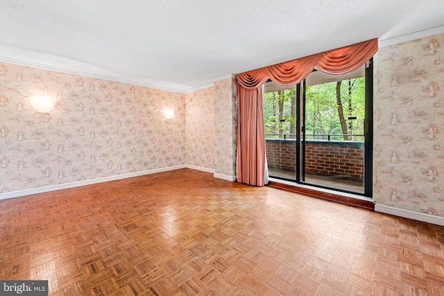 unfurnished room featuring wallpapered walls, baseboards, a textured ceiling, and ornamental molding
