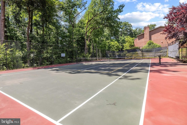 view of tennis court with fence